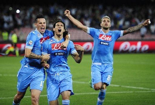 Napoli forward Edinson Cavani (C) celebrates with Marek Hamsik (L) and Valom Behrami after scoring on May 5, 2013