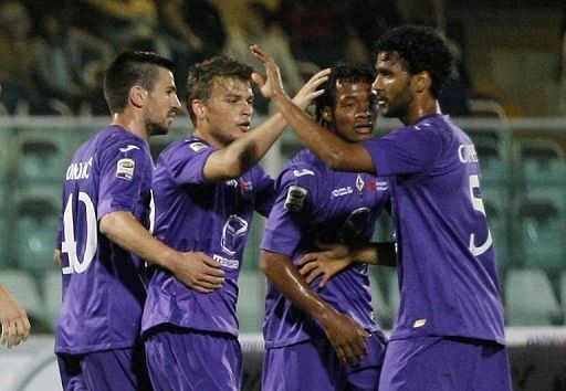 Fiorentina forward Adem Ljalic (2nd L) celebrates with teammates after scoring against Pescara Calcio on May 19, 2013
