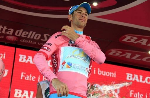 Italian Vincenzo Nibali celebrates the pink jersey on May 21, 2013 in Ivrea