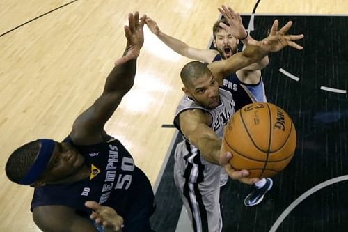 San Antonio's Tim Duncan (C) attempts a shot next to the Grizzlies' Zach Randolph (L) and Marc Gasol on May 21, 2013