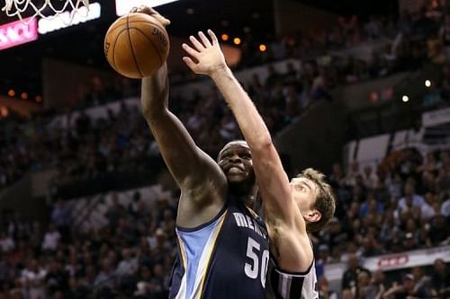 Memphis Grizzlies' Zach Randolph reaches for a rebound next to the San Antonio Spurs' Tiago Splitter on May 21, 2013