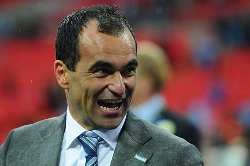 Wigan Athletic's Roberto Martinez celebrates after winning the English FA Cup at Wembley Stadium on May 11, 2013