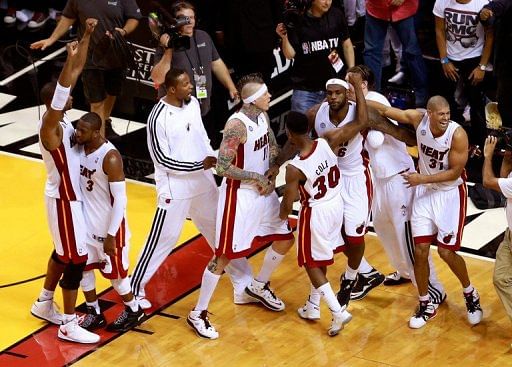 The Miami Heat players celebrate after defeating the Indiana Pacers, in Miami, on May 22, 2013
