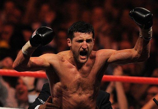 Carl Froch celebrates after beating Lucian Bute of Romania in Nottingham, England on May 26, 2012