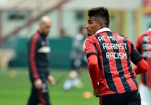 AC Milan&#039;s Kevin Prince Boateng warms up wearing a jersey against racism on January 6 , 2013 in Milan