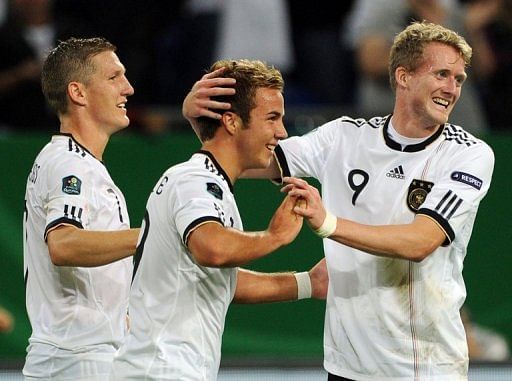 Germany&#039;s Bastian Schweinsteiger, Mario Goetze and Andr&Atilde;&copy; Schuerrle against Austria in Gelsenkirchen, September 2, 2011