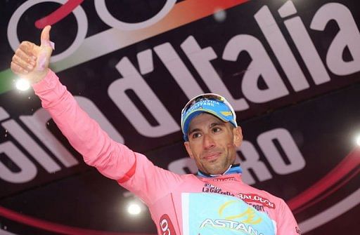 Vincenzo Nibali celebrates on the podium after winning the 18th stage of the 96th Giro d&#039;Italia on May 23, 2013 in Polsa