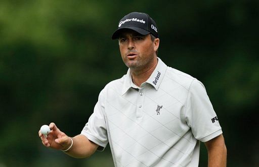 Ryan Palmer waves to the gallery on the fifth hole on May 23, 2013 in Fort Worth