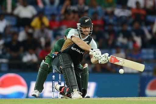 New Zealand batsman Daniel Vettori and Pakistan wicket keeper Kamran Akmal (left) on September 23, 2012