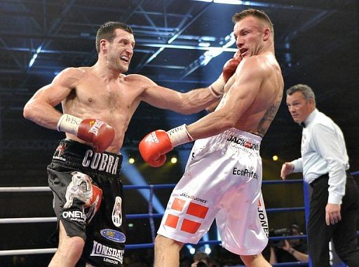 Carl Froch (left) hits Mikkel Kessler during their super-middleweight fight in Herning, on April 24, 2010