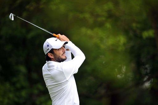 Italian golfer Francesco Molinari watches his shot at Wentworth Golf Club in Surrey, England, on May 23, 2013