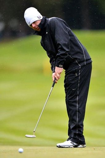 Northern-Irish golfer Rory McIlroy putts on the 15th green at Wentworth Golf Club in Surrey, England, on May 24, 2013