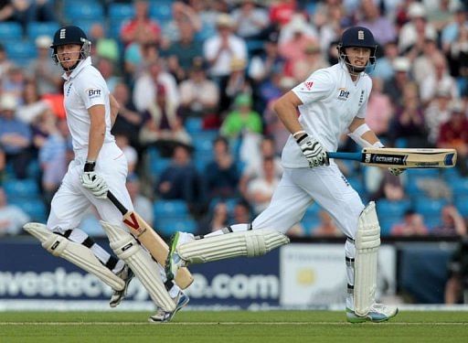 England batsman Jonny Bairstow (L) runs to complete a half century with Joe Root at the Headingley stadium, May 25, 2013