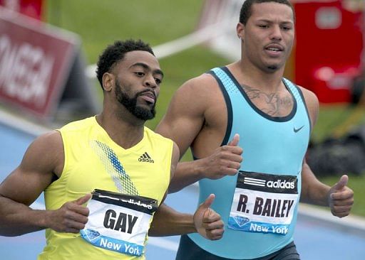 Tyson Guy of the US (L) wins the 100-meter dash, May 25, 2013 in New York