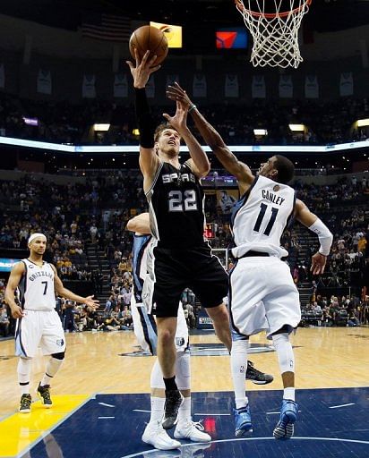 Tiago Splitter of the Spurs shoots the ball against Mike Conley of the Grizzlies, May 25, 2013 in Memphis, Tennessee