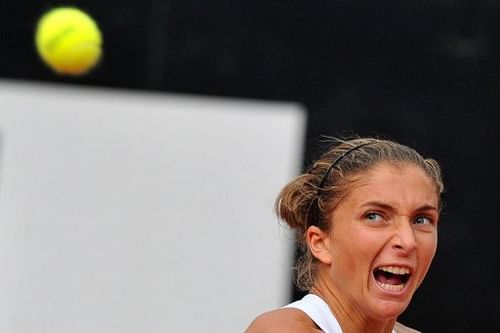 Italy's Sara Errani eyes a ball during a Rome Masters semi-final against Belarus' Victoria Azarenka on May 18, 2013