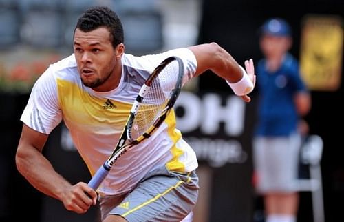 Jo-Wilfried Tsonga runs to return a shot, in Rome, on May 15, 2013