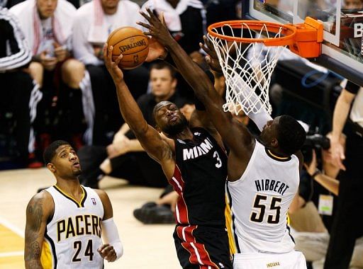 Dwyane Wade of the Miami Heat goes up against Roy Hibbert of the Indiana Pacers on May 26, 2013