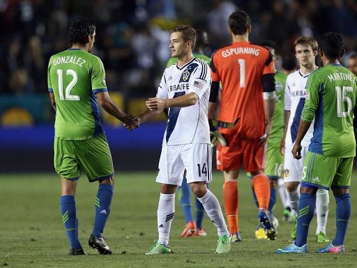 Leo Gonzalez (L) of Seattle Sounders FC and Robbie Rogers of Los Angeles Galaxy shake hands on May 26, 2013