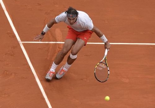 Spain's Rafael Nadal returns to Germany's Daniel Brands in Paris, on May 27, 2013