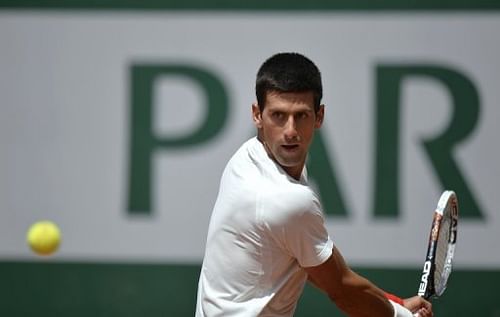 Serbia's Novak Djokovic practices during a training session at the Roland Garros stadium in Paris on May 25,  2013