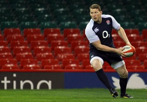 England's Dylan Hartley passes the ball during a training session in Cardiff on March 15, 2013