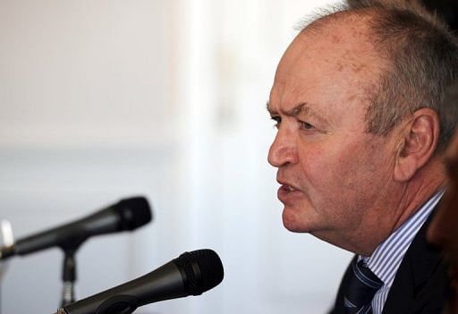 Former All Blacks coach Graham Henry (R) answers questions during a press conference in Buenos Aires on May 30, 2012