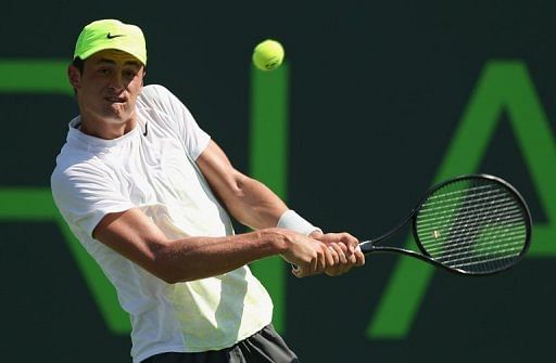 Australia&#039;s Bernard Tomic plays a backhand against Britain&#039;s Andy Murray in Key Biscayne, on March 23, 2013