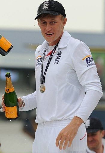 England's Joe Root celebrates a series win on the fifth day of the second Test against New Zealand on May 28, 2013