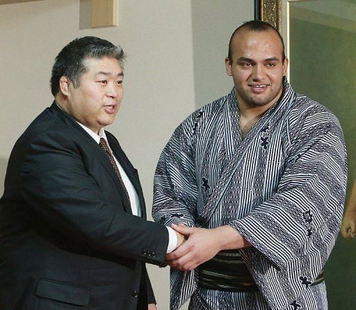 Abdelrahman Ahmed Shaalan (R) is promoted to the second highest division in sumo wrestling in Tokyo on May 29, 2013