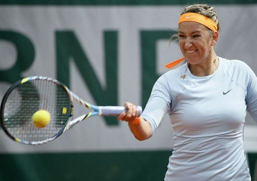 Victoria Azarenka hits a forehand to Elena Vesnina during their French Open match in Paris, on May 29, 2013