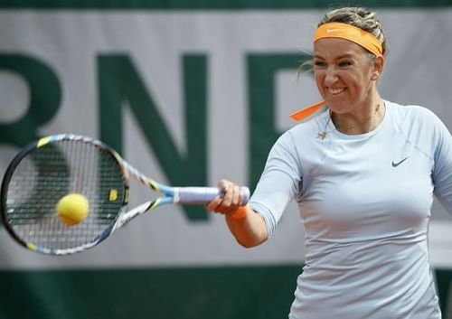 Victoria Azarenka hits a forehand to Elena Vesnina during their French Open match in Paris, on May 29, 2013