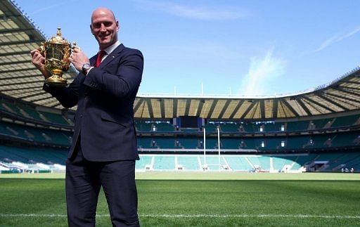 Former England captain Lawrence Dallaglio poses with the Webb Ellis Cup at Twickenham Stadium in London on May 2, 2013