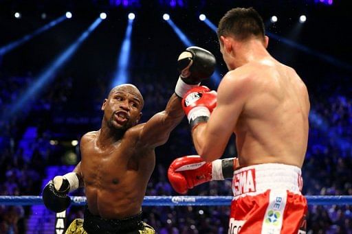Floyd Mayweather throws a left at Robert Guerrero during their WBC welterweight title bout in Las Vegas on May 4, 2013