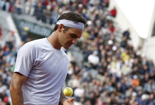 Switzerland's Roger Federer gets ready to serve at the Roland Garros stadium in Paris, on May 29,  2013