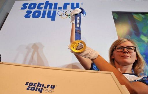 The Sochi 2014 Olympic gold medal is unveiled at the SportAccord International Convention in St Petersburg, May 30, 2013