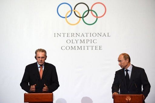 Vladimir Putin (R) and Jacques Rogge attend an IOC executive board meeting in St. Petersburg, on May 30, 2013