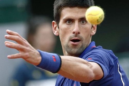 Serbia's Novak Djokovic prepares a shot to Argentina's Guido Pella in Paris on May 30, 2013