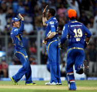 Mumbai Indians players celebrate fall of wicket during the match between Mumbai Indians vs Delhi Daredevils Played at Wankhede Stadium in Mumbai, 9 April 2013. (Photo: IANS)