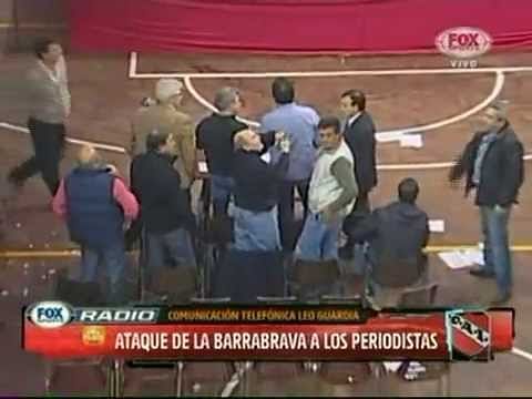 Video: Disgraceful fans throw chairs and tables at Independiente club president