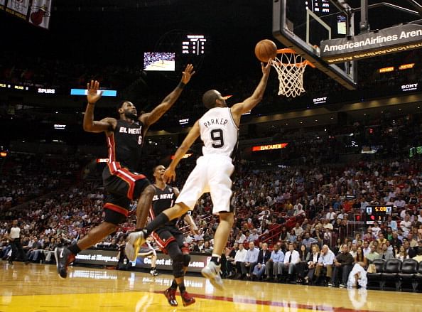 Tony Parker of the San Antonio Spurs, pictured here in 2011, drives to the basket as he is flollowed by LeBron James #6 of the Miami Heat at American Airlines Arena. The duo are set to face-off in the 2013 NBA Finals. (Getty Images)