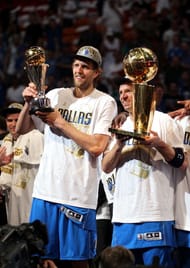 Finals MVP Dirk Nowitzki #41 and Jason Kidd #2 of the Dallas Mavericks celebrate with the Larry O'Brien Championship trophy after the Mavericks won 105-95 against the Miami Heat in Game Six of the 2011 NBA Finals at American Airlines Arena on June 12, 2011 in Miami, Florida. NOTE TO USER: User expressly acknowledges and agrees that, by downloading and/or using this Photograph, user is consenting to the terms and conditions of the Getty Images License Agreement. (Photo by Mike Ehrmann/Getty Images)
