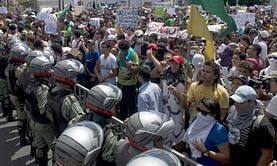 Brazil fare hikes rolled back but protesters, police clash