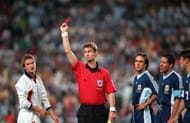 Referee Kim Milton Nielsen sends off England's David Beckham for kicking out at Diego Simeone