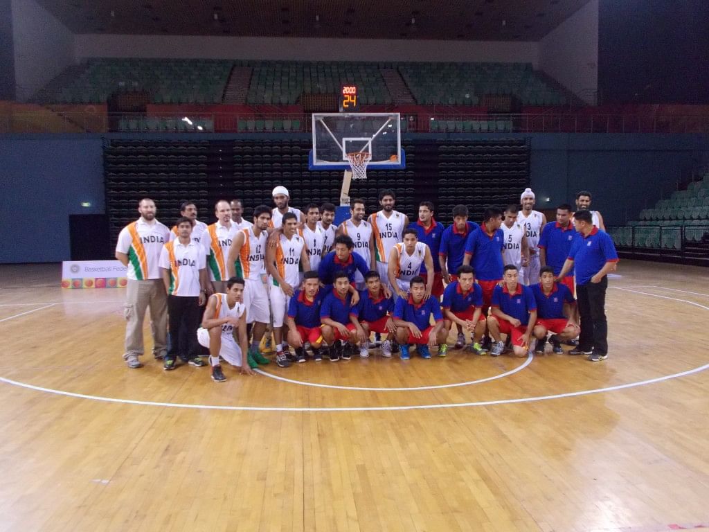 Friendly Neighbours: The India and Nepal teams pose for a joint photograph after the game. Copyright: Gopalakrishnan R