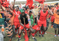 Odafa Okolie (holding the flag) and to his left Felix Chimaokwu (hand on head) celebrate Churchill Brothers' first league triumph
