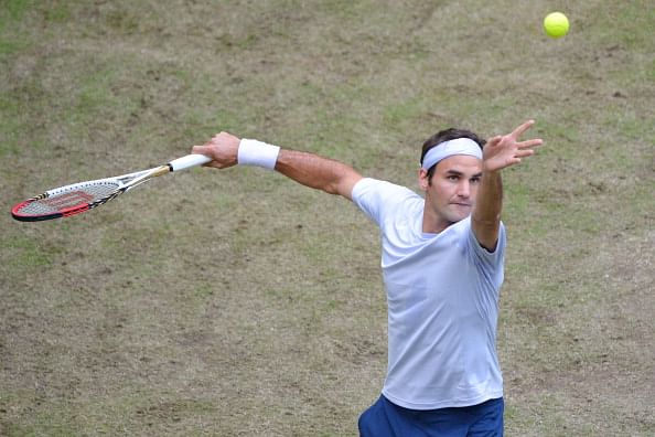 Tennis: Federer eases into Halle quarters on grass return