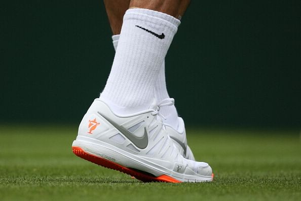 Federer breaks Wimbledon's all white rules