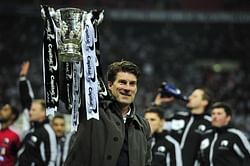 Swansea must do whatever it takes to keep Laudrup and Michu