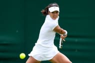 Na Li of China plays a backhand during her Ladies' Singles first round match against Michaella Krajicek of Netherlands on day two of the Wimbledon Lawn Tennis Championships at the All England Lawn Tennis and Croquet Club on June 25, 2013 in London, England. (Photo by Mike Hewitt/Getty Images)